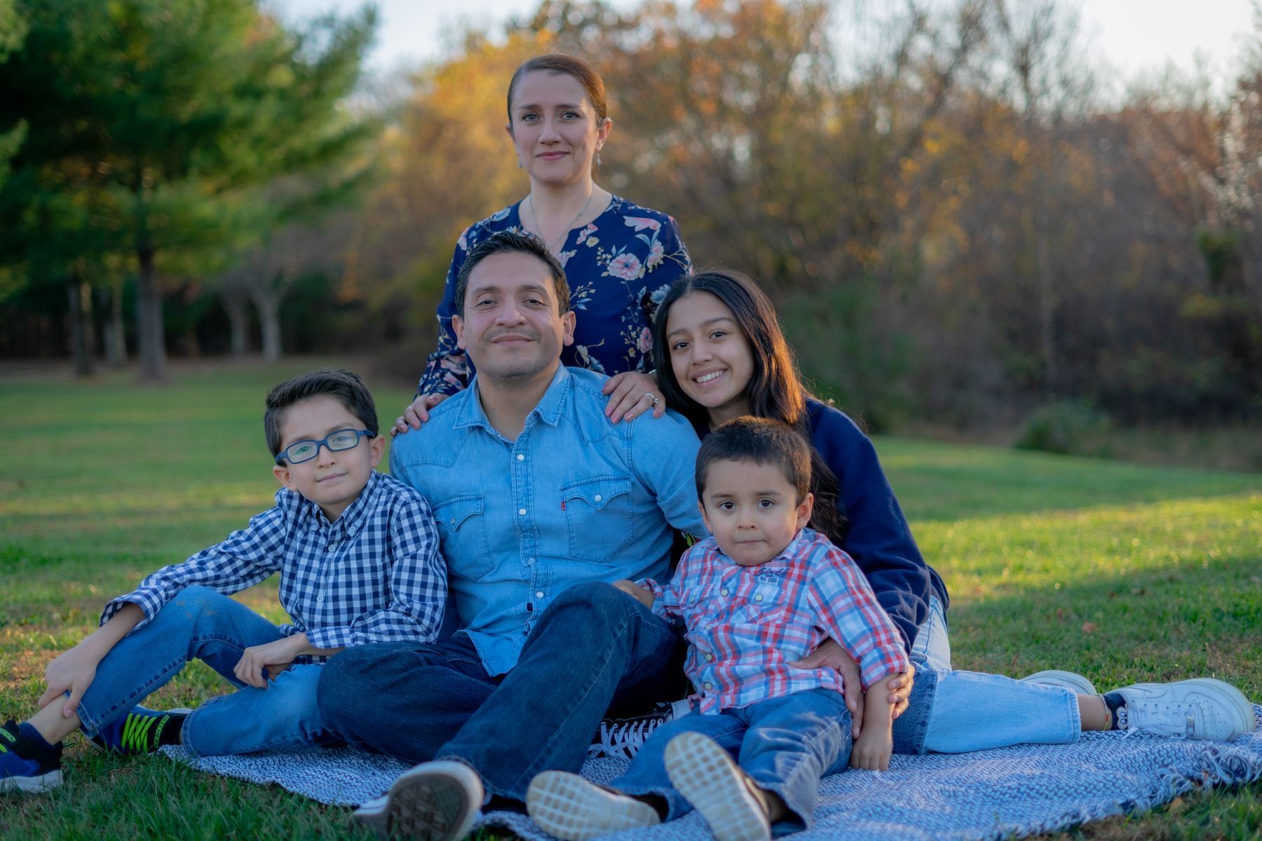 A family sitting together on the grass